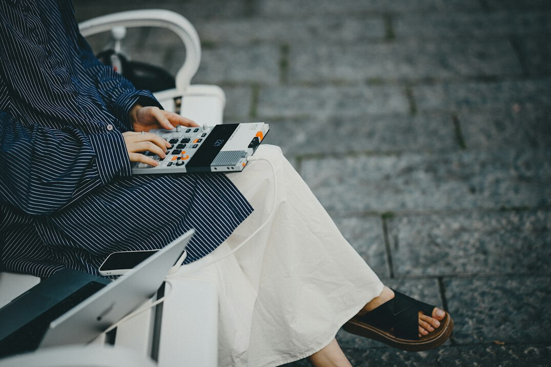 people using digital devices in public