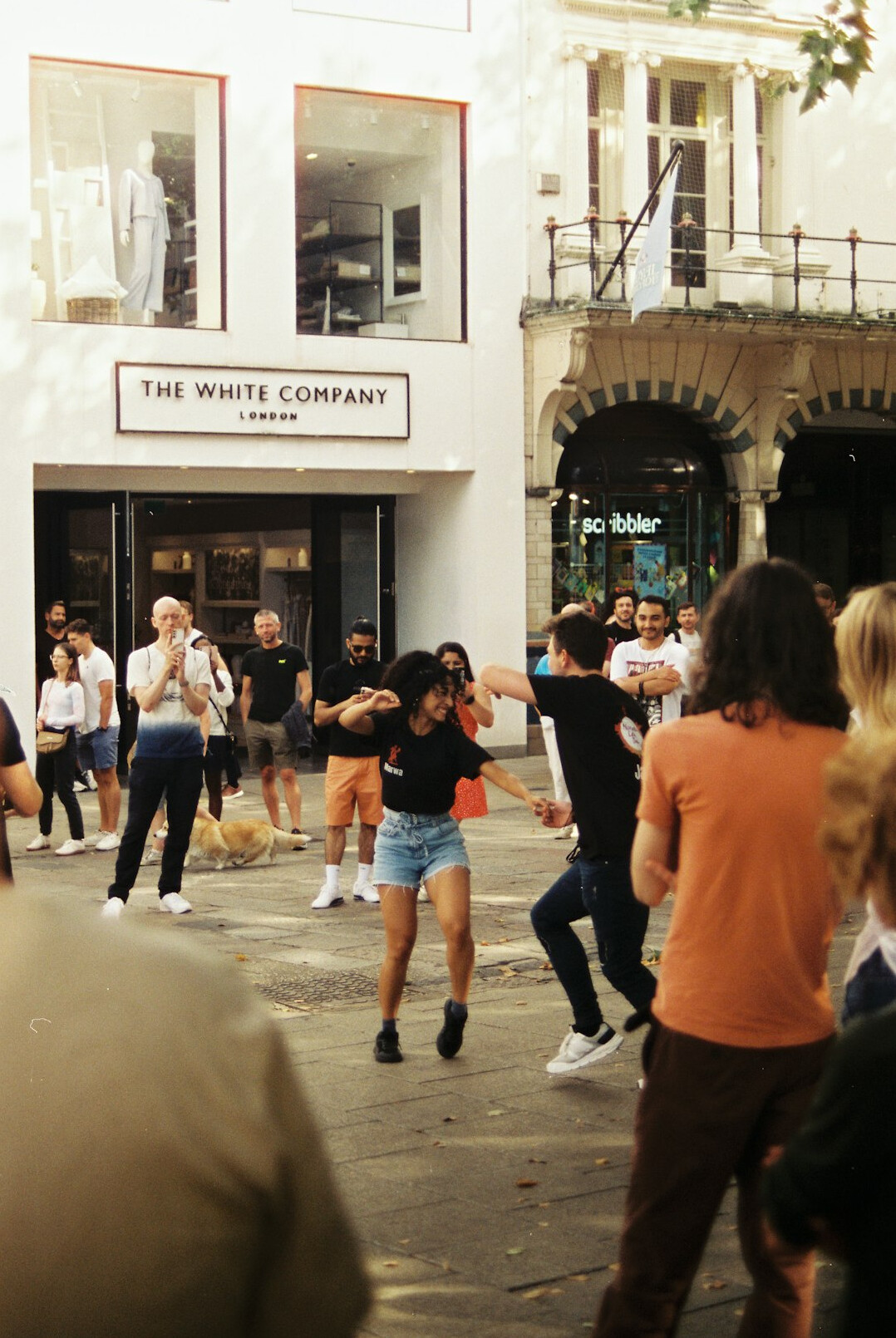 group of people arguing in street