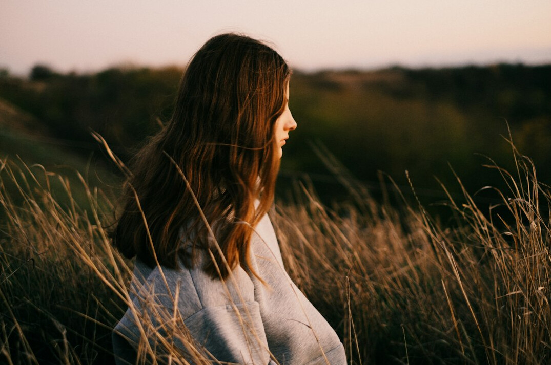 person reflecting alone in nature