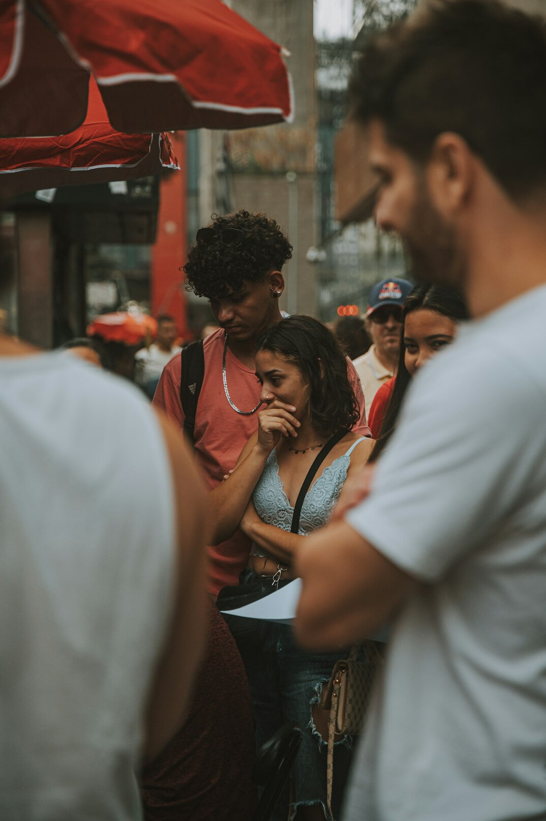 group of people arguing in street