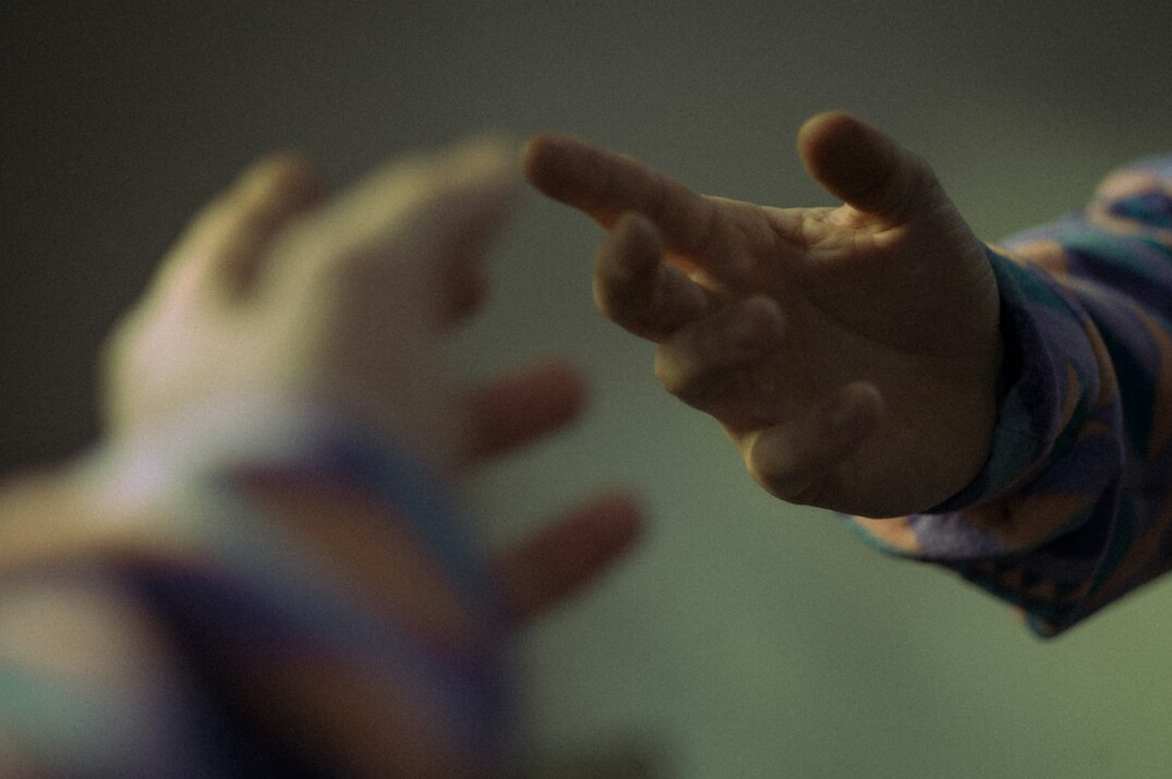 Close-up of hands gesturing in conversation